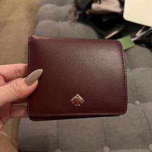 kate spade burgundy leather compact wallet with gold spade